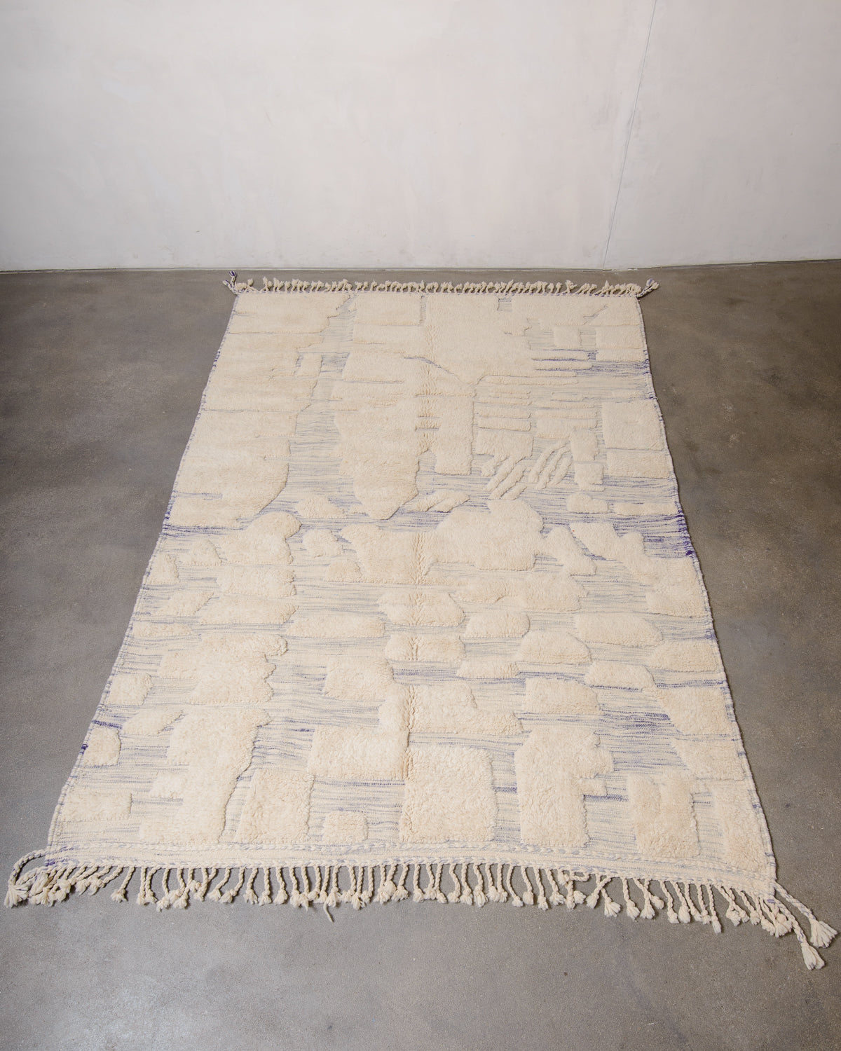 Modern, designer, handcrafted Berber rug from Morocco. Beniourain carpet with beautiful colours and patterns and fluffy wool texture.